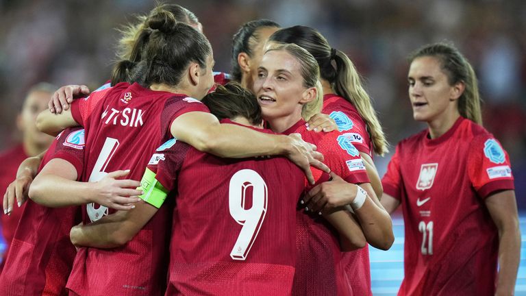 Poland's Ewa Pajor, centre, celebrates with teammates after scoring her side's second goal 