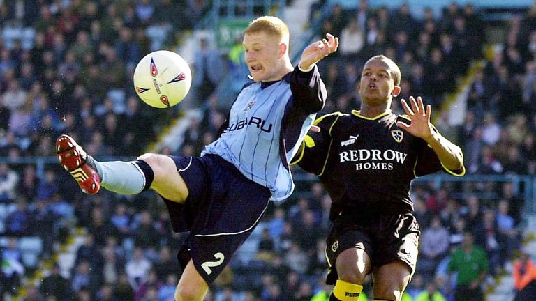 Coventry's Andrew Whing challenges Cardiff's Robert Earnshaw during their Nationwide Division One match at Highfield Road, Coventry.