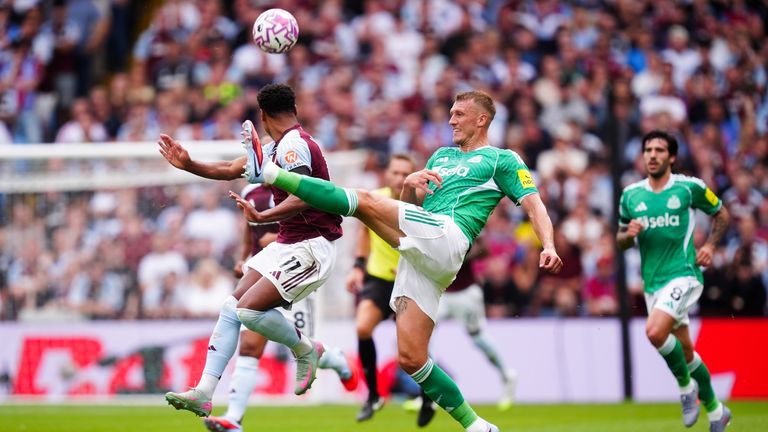 Newcastle United's Dan Burn (right) and Aston Villa's Ollie Watkins battle for the ball during the Premier League match at Villa Park, Birmingham. Picture date: Saturday August 16, 2025.