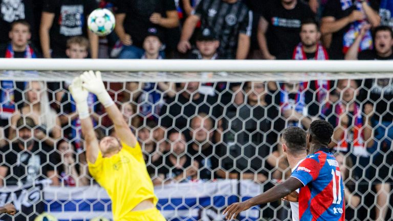 PLZEN, CZECH REPUBLIC - AUGUST 12: Viktoria Plzen's Lukas Cerv (L) takes a shot but it's pushed over the crossbar by Rangers' Jack Butland during a UEFA Champions League Third Round Qualifier, Second Leg, between Viktoria Plzen and Rangers at the Doosan Arena, on August 12, 2025, in Plzen, Czech Republic. (Photo by Alan Harvey / SNS Group)