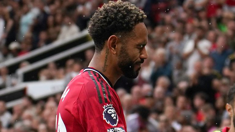 Manchester United's Matheus Cunha leaves the pitch after picking up an injury