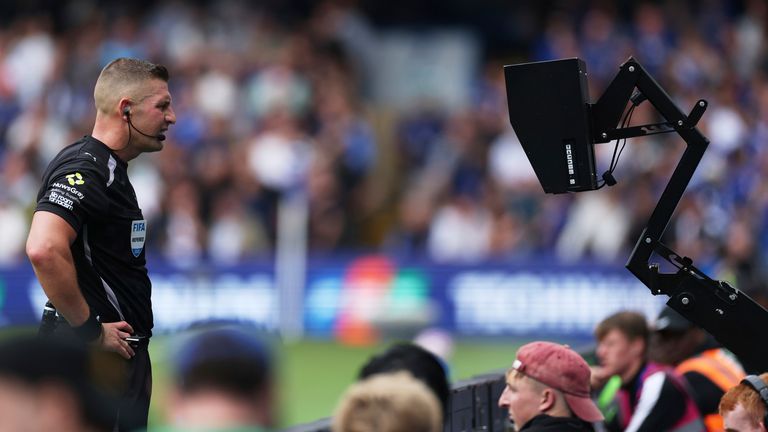 Referee Robert Jones checks the VAR monitor at Stamford Bridge (AP Photo/Ian Walton)