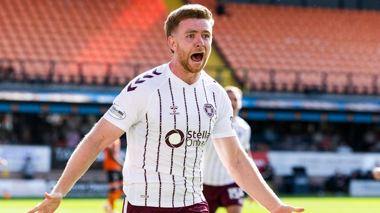 Stuart Findlay celebrates after scoring to make it 3-2 to Hearts