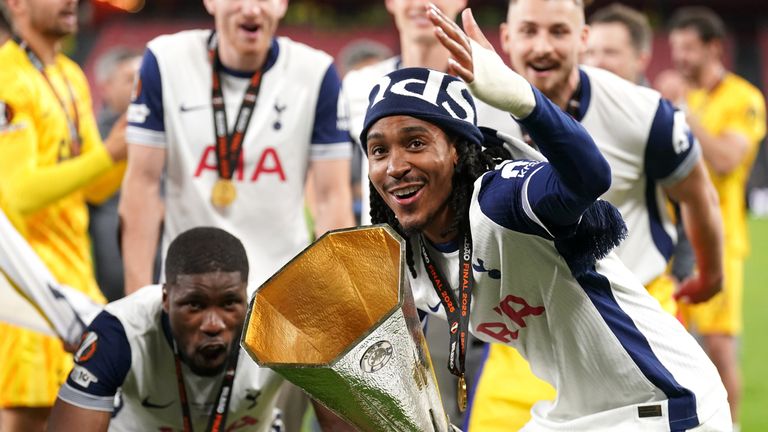 Tottenham Hotspur's Djed Spence with the trophy following the UEFA Europa League final at the Estadio de San Mames in Bilbao, Spain.