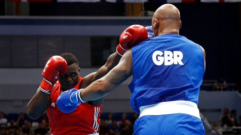 Nelvie Tiafack beats Frazer Clarke in their amateur bout.