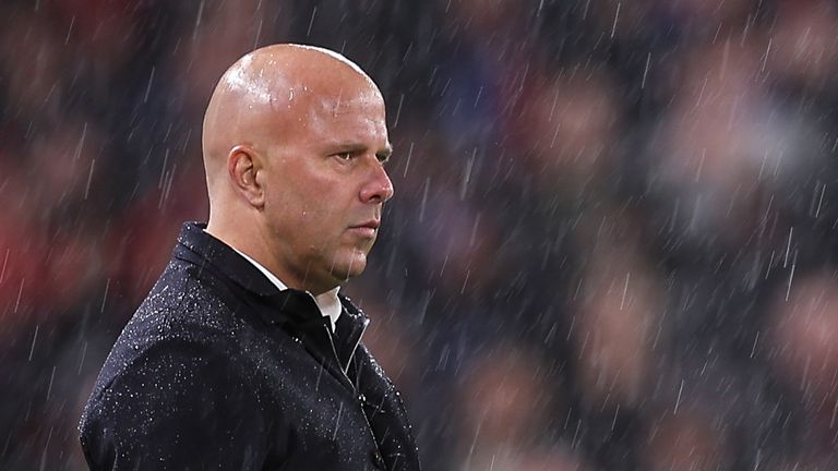 Arne Slot looks on at a wet Anfield as Liverpool fall to Carabao Cup defeat against Crystal Palace - their sixth loss in seven games