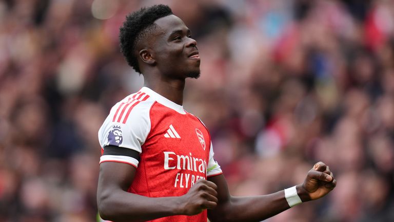 Arsenal's Bukayo Saka celebrates scoring against West Ham
