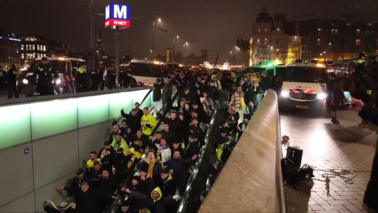 Police escort Maccabi Tel Aviv supporters to the metro after pro-Palestinian supporters marched near the Johan Cruyff Stadium