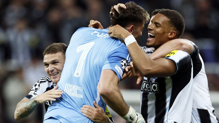 Newcastle United goalkeeper Nick Pope (centre) celebrates with team-mates after assisting Harvey Barnes' goal against Benfica