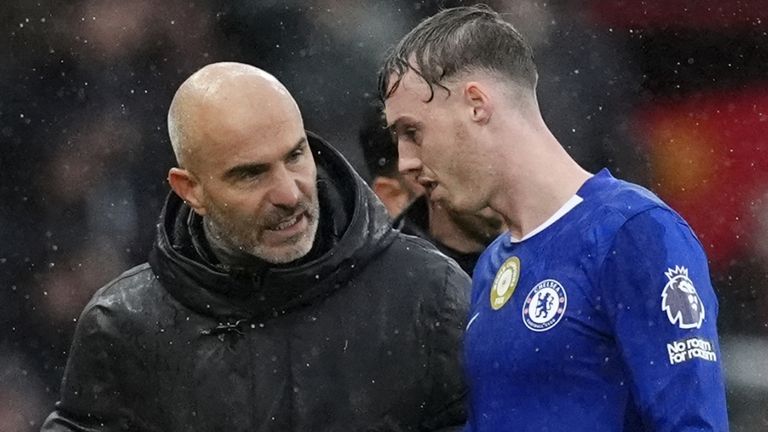 Cole Palmer (right) speaks with Chelsea head coach Enzo Maresca after injuring his groin in September 