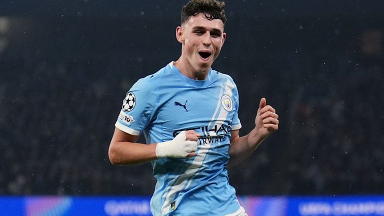 Phil Foden celebrates after scoring his second goal for Man City against Borussia Dortmund