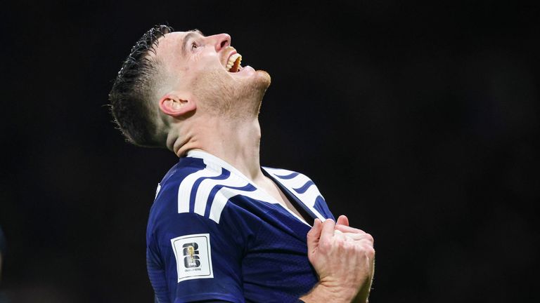 GLASGOW, SCOTLAND - NOVEMBER 18: Scotland's Andy Robertson celebrates as teammate Kieran Tierney scores to make it 3-2 during a FIFA World Cup 2026 Qualifier between Scotland and Denmark at Hampden Park, on November 18, 2025, in Glasgow, Scotland. (Photo by Ross Parker / SNS Group)