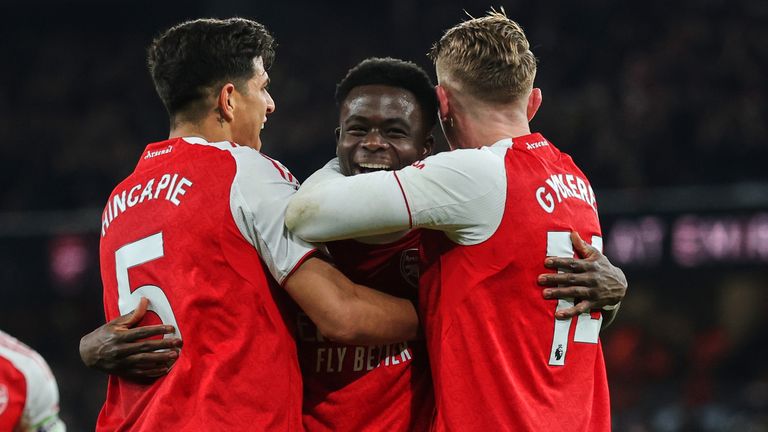 Arsenal players celebrate their win over Wolves