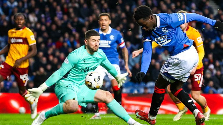  Motherwell's Calum Ward makes a save to deny Rangers Djeidi Gassama 