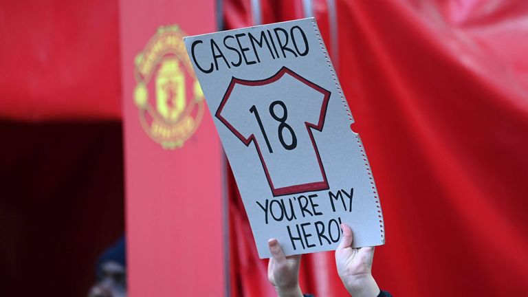 A fan holds a sign with a No.18 shirt on it and a caption that reads: "You're my hero". 
Michael Regan/Getty Images