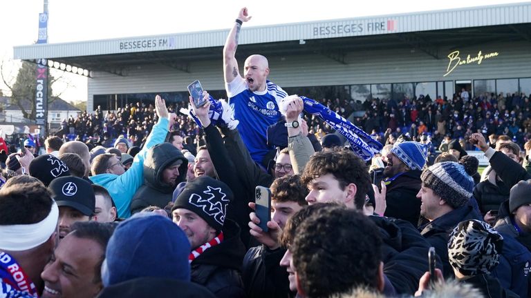Macclesfield's John Kay is chaired off the pitch by supporters after his team beat FA Cup holders Crystal Palace 2-1