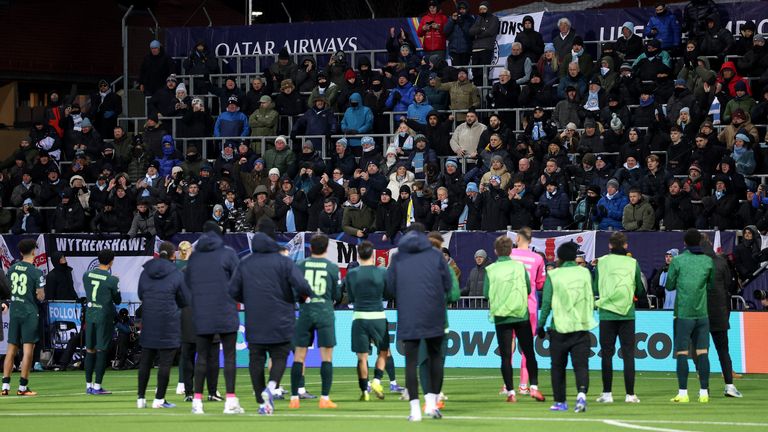 Manchester City players applaud their supporters after losing at Bodo/Glimt
