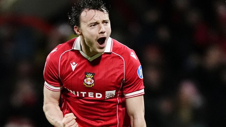 Wrexham's Ollie Rathbone celebrates putting them into a 2-0 lead against Nottingham Forest in the FA Cup third-round tie