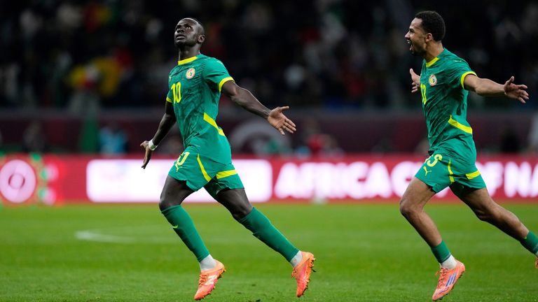 Senegal's Sadio Mane, left, celebrates after scoring his side's opening goal during the Africa Cup of Nations semifinal soccer match between Senegal and Egypt, in Tangier, Morocco, Wednesday, Jan. 14, 2026. (AP Photo/Themba Hadebe)