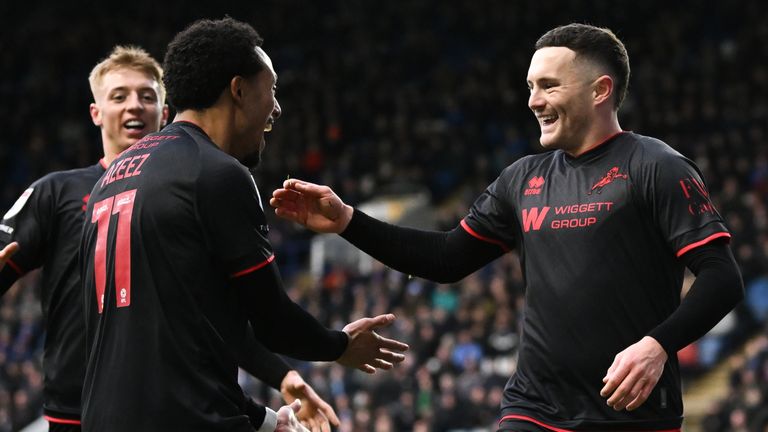 Macaulay Langstaff of Millwall celebrates scoring his team's second goal of the game with teammates