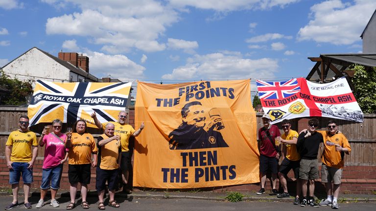 Wolves fans pictured with a 'first the points, then the pints' flag in support of Vitor Pereira