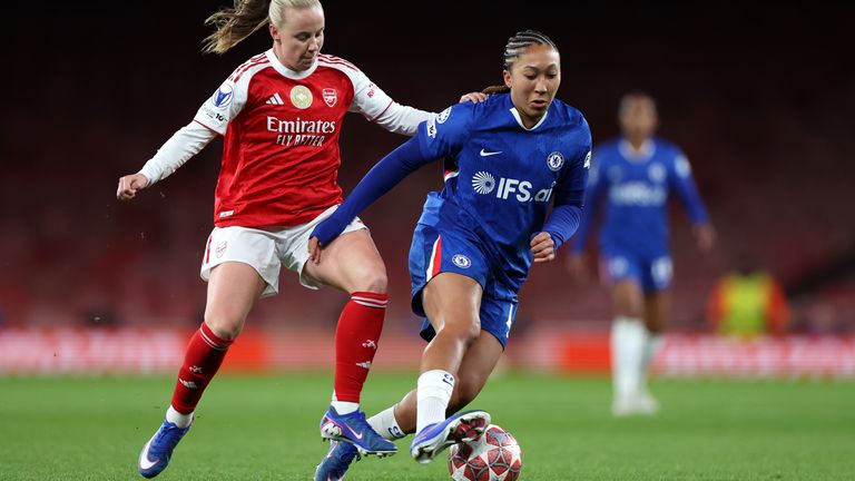 Beth Mead tries to win the ball off Lauren James