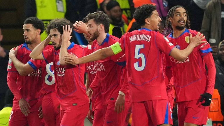 PSG players celebrate Bradley Barcola's first-half goal at Stamford Bridge