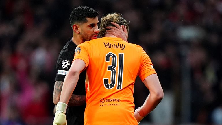 Cristian Romero embraces Antonin Kinsky as he leaves the pitch