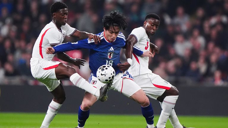 England's Kobbie Mainoo and Marc Guehi battle with Japan's Ayase Ueda (centre) during the international friendly match at Wembley Stadium,