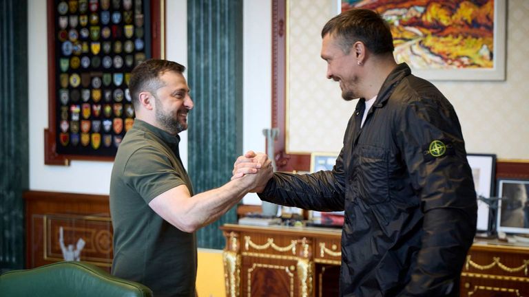 In this photo, provided by the Ukrainian Presidential Press Office, Ukrainian President Volodymyr Zelenskyy, left, shakes hands with world heavyweight boxing champion Oleksandr Usyk in Kyiv, Ukraine, Saturday, Aug. 2, 2025. (Ukrainian Presidential Press Office via AP)