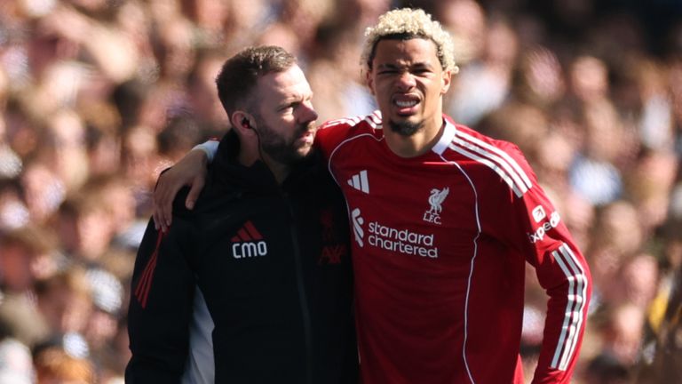 Hugo Ekitike is helped off the field after suffering an injury at the Amex