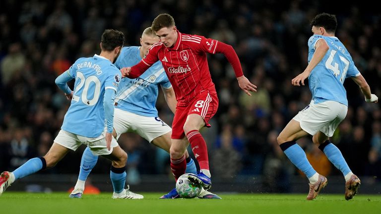 Elliot Anderson is crowded by Phil Foden, Erling Haaland and Bernardo Silva