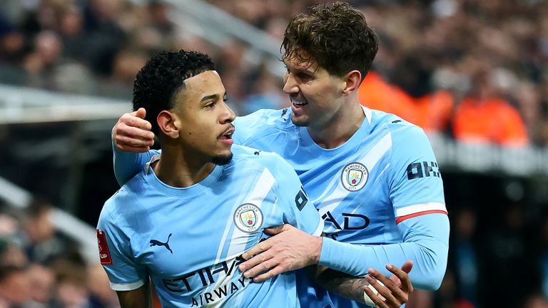 Savinho celebrates his equaliser for Man City at Newcastle with John Stones