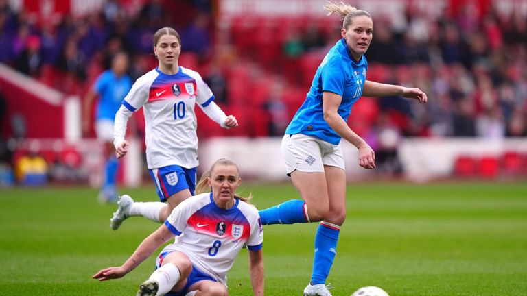 Hildur Antonsdottir in action with England's Georgia Stanway and Jess Park