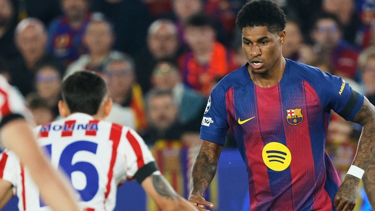 Barcelona's Marcus Rashford drives at the Atletico Madrid defence