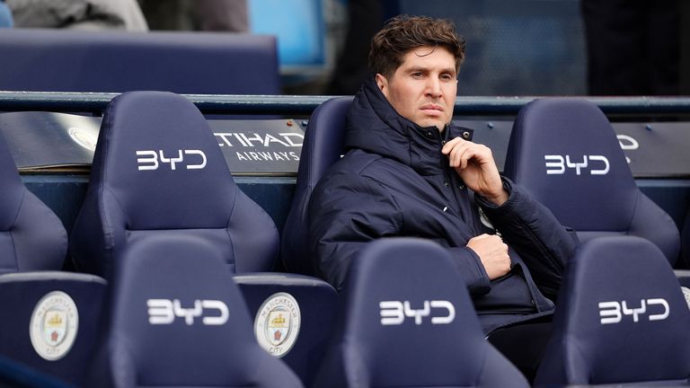 Manchester City's John Stones in the dugout ahead of the Premier League match against Brentford at Etihad Stadium