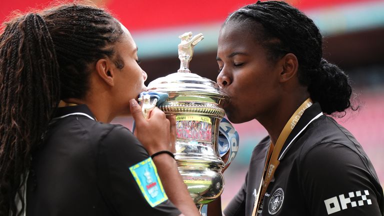 Khadija Shaw and Jade Rose kiss the FA Cup trophy 