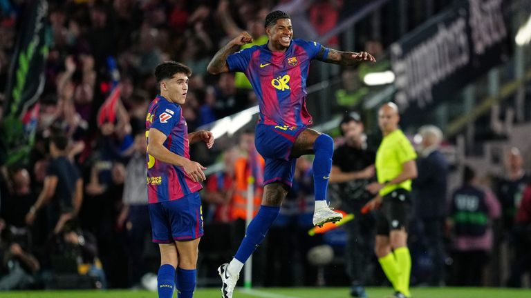 Barcelona's Marcus Rashford celebrates after scoring the opening goal during the Spanish La Liga soccer match between FC Barcelona and Real Madrid in Barcelona, Spain, Sunday, May 10, 2026. (AP Photo/Joan Mateu Parra)