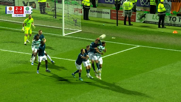 Sam Nicholson gives away a penalty for handball against Celtic