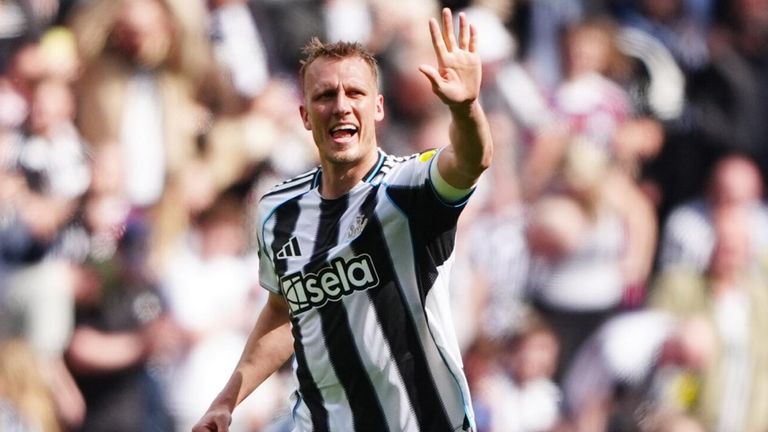 Dan Burn celebrates after doubling Newcastle's lead against Brighton