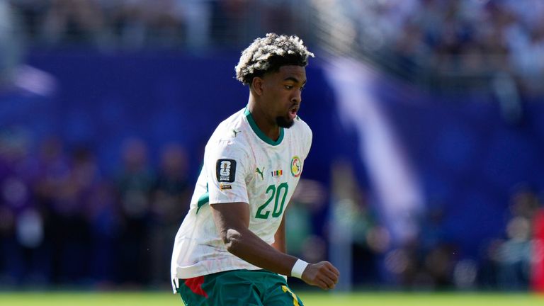 Senegal's Ibrahim Mbaye (20) controls the ball during the World Cup Group I soccer match between France and Senegal in East Rutherford, N.J., near New York, Tuesday, June 16, 2026. (AP Photo/Steve Luciano)