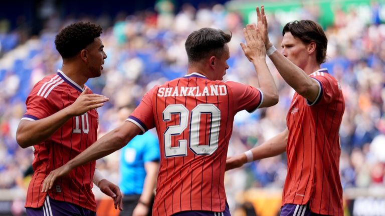 Lawrence Shankland celebrates with Che Adams and Scott McTominay for Scotland 