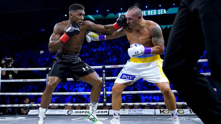 Joshua (left) trained with Usyk's (right) camp in preparation for his bout against Kristian Prenga 
