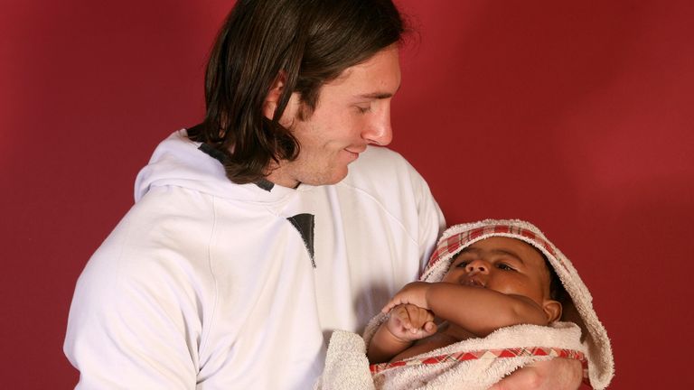 20-year-old soccer star Lionel Messi cradles Lamine Yamal, who was merely six months old at the time during a photo session in Sept. 2007 in the dressing room of the Camp Nou stadium in Barcelona, Spain. (AP Photo/Joan Monfort)