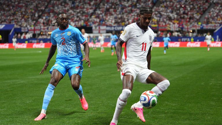 England's Marcus Rashford controls the ball as DR Congo's Aaron Wan-Bissaka looks on (AP Photo/Jacob Kupferman)