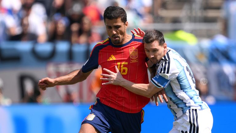 Spain's Rodri and Argentina's Lionel Messi in action in the World Cup final
