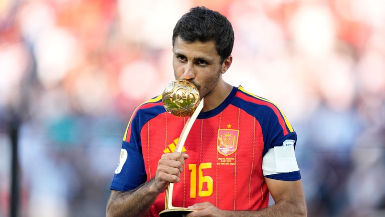 Spain's Rodri poses with the award for the tournament's best player (AP Photo/Ashley Landis)