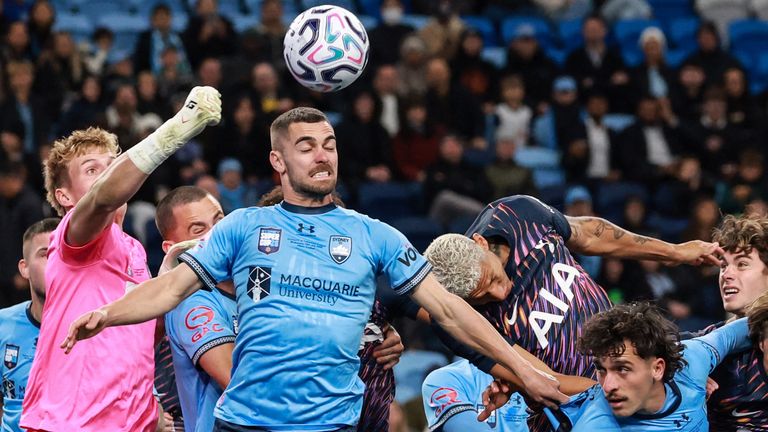 Sydney's goalkeeper Gus Hoefsloot (L) makes a save during the Sydney Super Cup football match between Tottenham Hotspur and Sydne