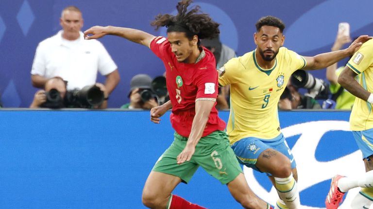 Morocco's Ayyoub Bouaddi dribbles past Brazil's Matheus Cunha