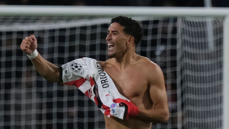 PSV's Couhaib Driouech celebrates after scoring his sides sixth goal during the Champions League opening phase soccer match between PSV and Napoli in Eindhoven, Netherlands,Tuesday, Oct. 21, 2025. (AP Photo/Patrick Post)